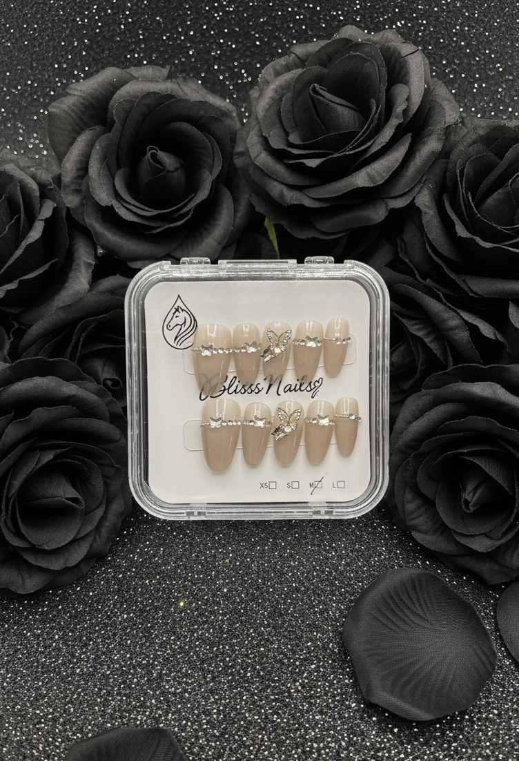 Blisss Nails Premium Handmade Nude Almond Fake Nails – Glossy Beige with Cat Eye Effect Artificial Reusable Press On Nails with Butterfly Charm & Crystal Chain Design | Elegant Salon Finish  10 pc Nail Set