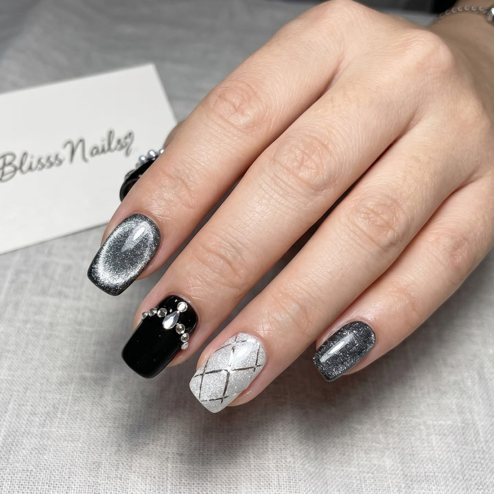 Blisss Nails Premium Handmade Black Glitter Fake Nails – Short Square Artificial Reusable Press On Nails with Rhinestones, Pearl Chain & Silver Pattern with Cat eye Effect Design | Luxury Salon Finish 10 pc Nail Set