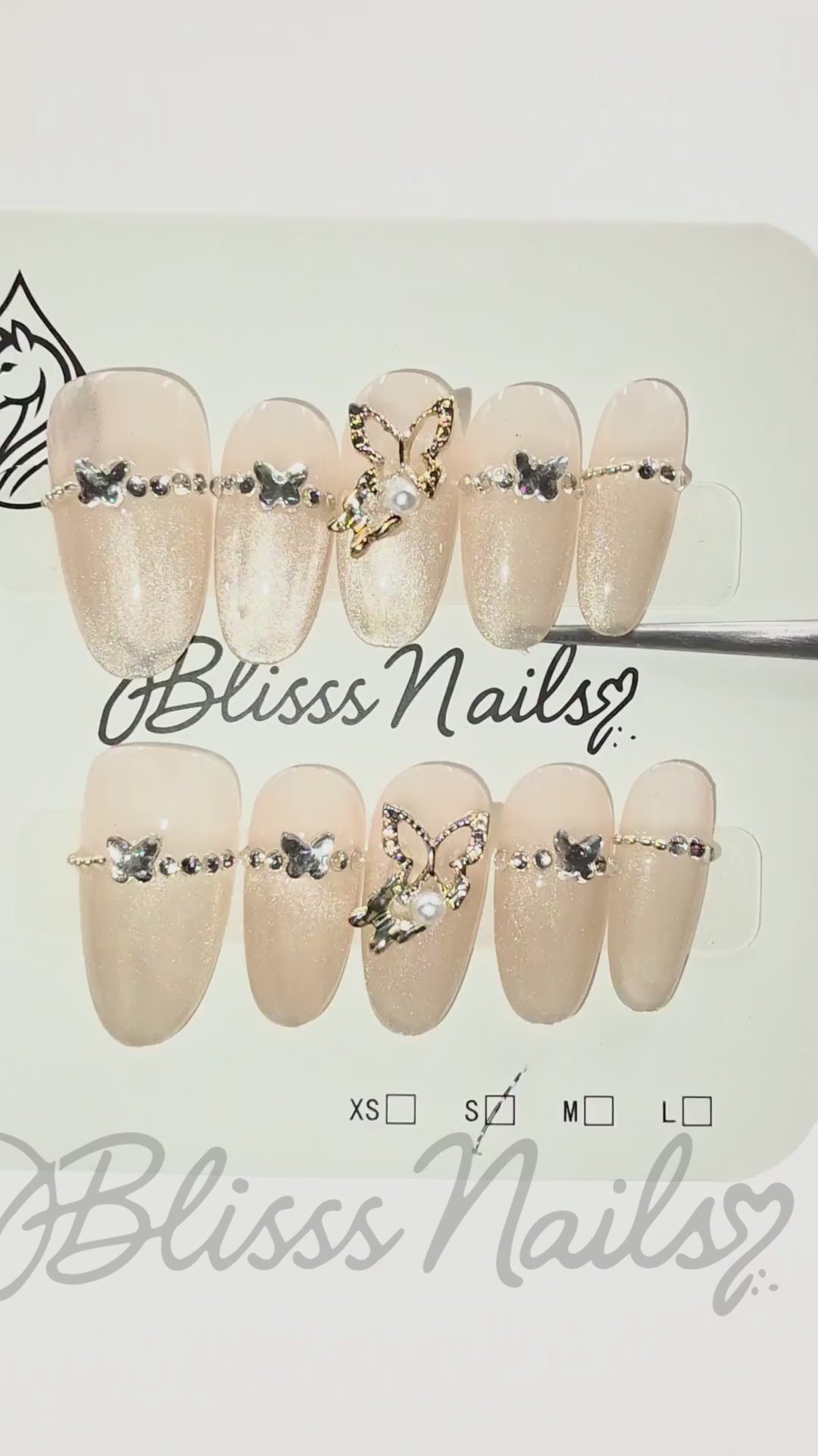 Blisss Nails Premium Handmade Nude Almond Fake Nails – Glossy Beige with Cat Eye Effect Artificial Reusable Press On Nails with Butterfly Charm & Crystal Chain Design | Elegant Salon Finish  10 pc Nail Set